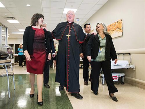 Cardinal Dolan, hospital staff