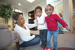 Rose Pernell and children visit Generate Health headquarters.