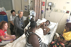 Palliative care team discusses treatment with patient