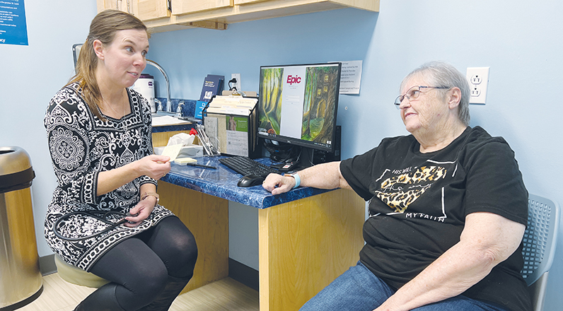 Dr. Joanne Waltman talks with patient Pat Niemeyer at the 65 Prime Plus Clinic.
