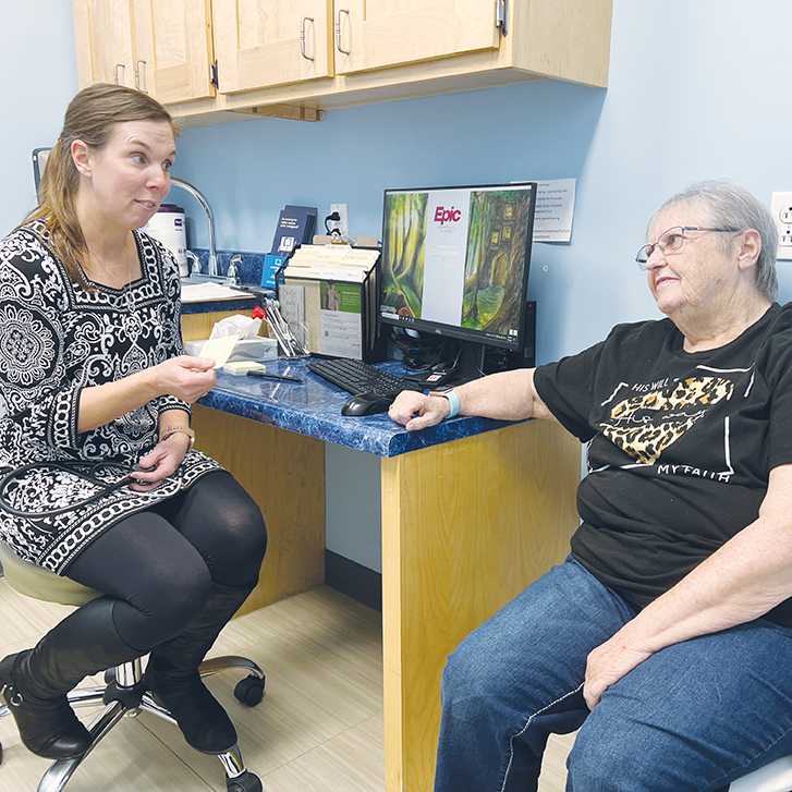 Dr. Joanne Waltman talks with patient Pat Niemeyer at the 65 Prime Plus Clinic.