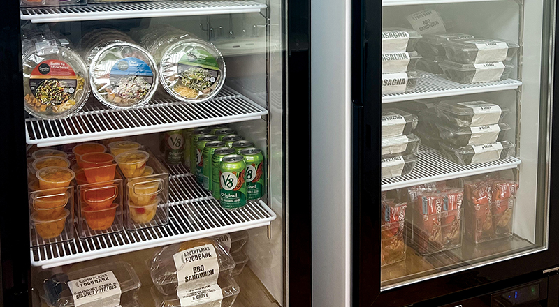 Refrigerators stocked with salads, fresh snacks and ready-to-eat or ready-to-heat meals.