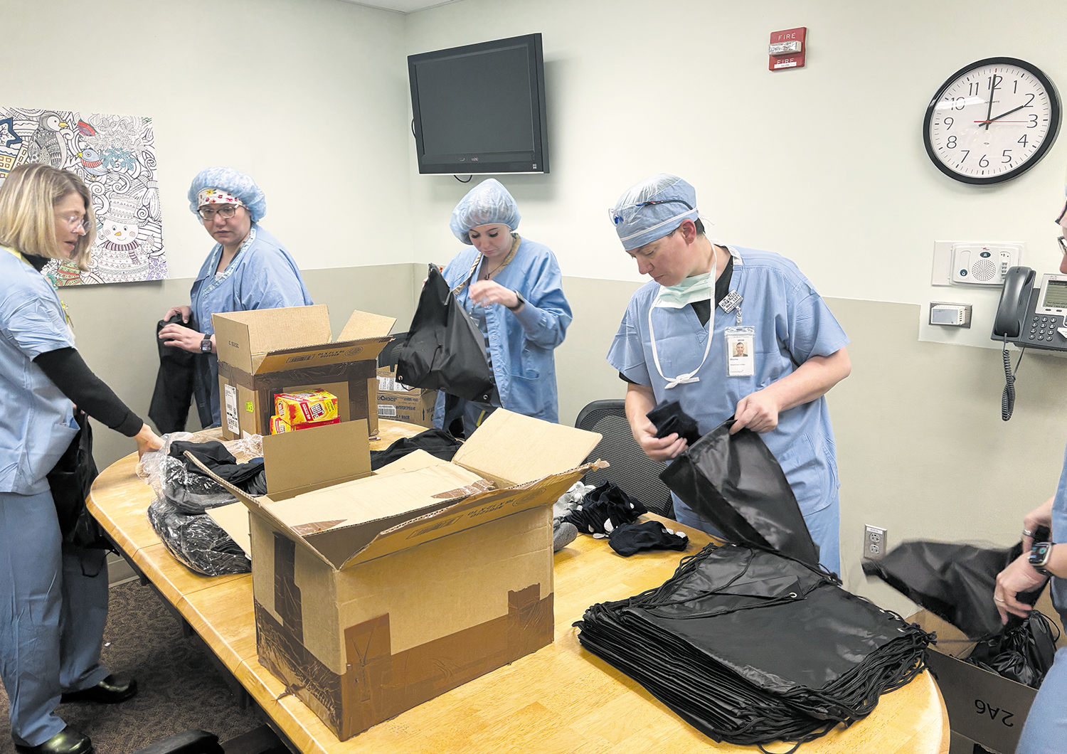 Colleagues in surgical services at CommonSpirit St. Thomas More Hospital in Canon City, Colorado, assemble “Blessing Bags” in February.