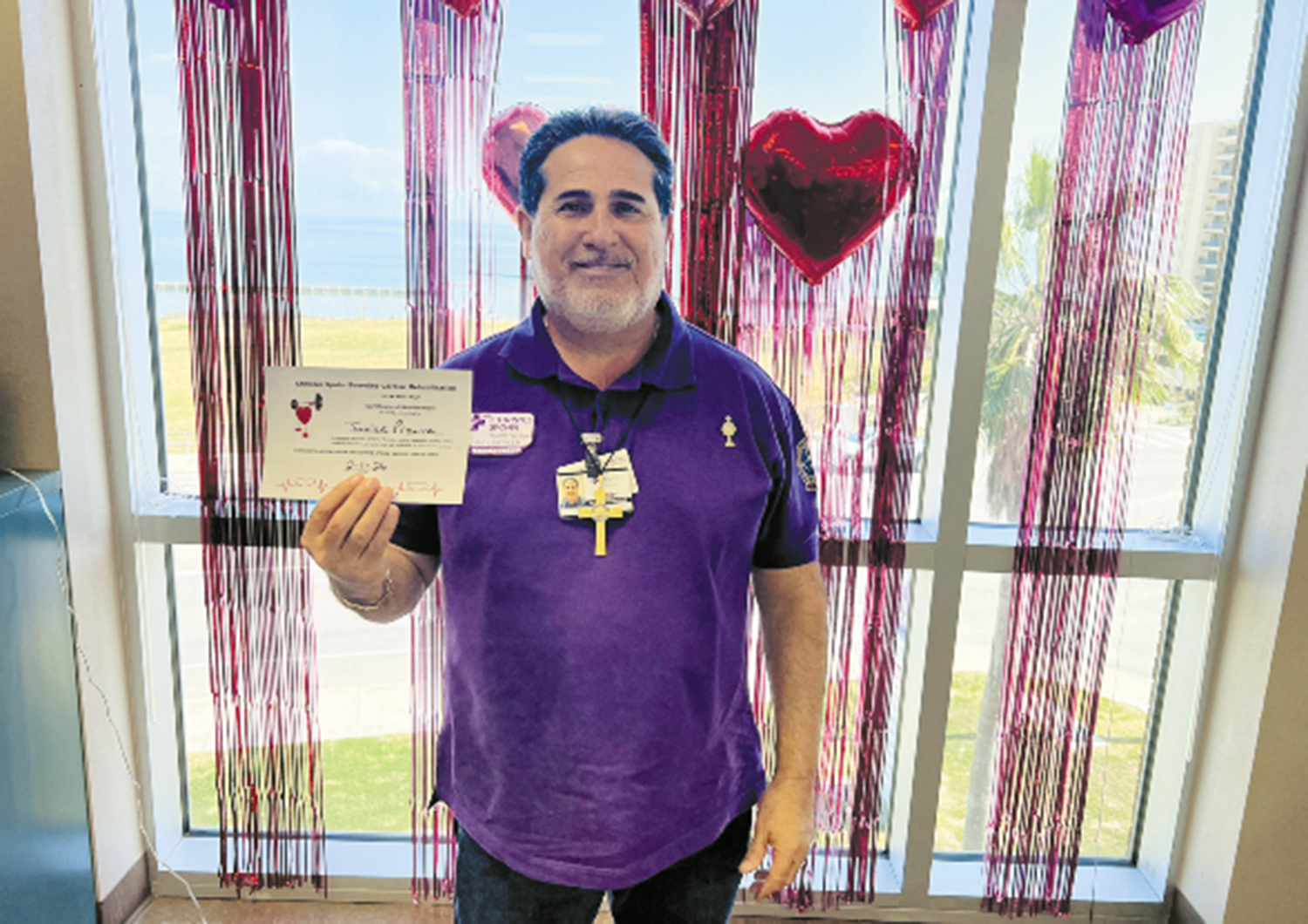 Javier Pizana holds his certificate for “graduating” from cardiac rehabilitation at CHRISTUS Spohn Hospital Corpus Christi — Shoreline in Texas. His experience at the hospital prompted him to become a volunteer.