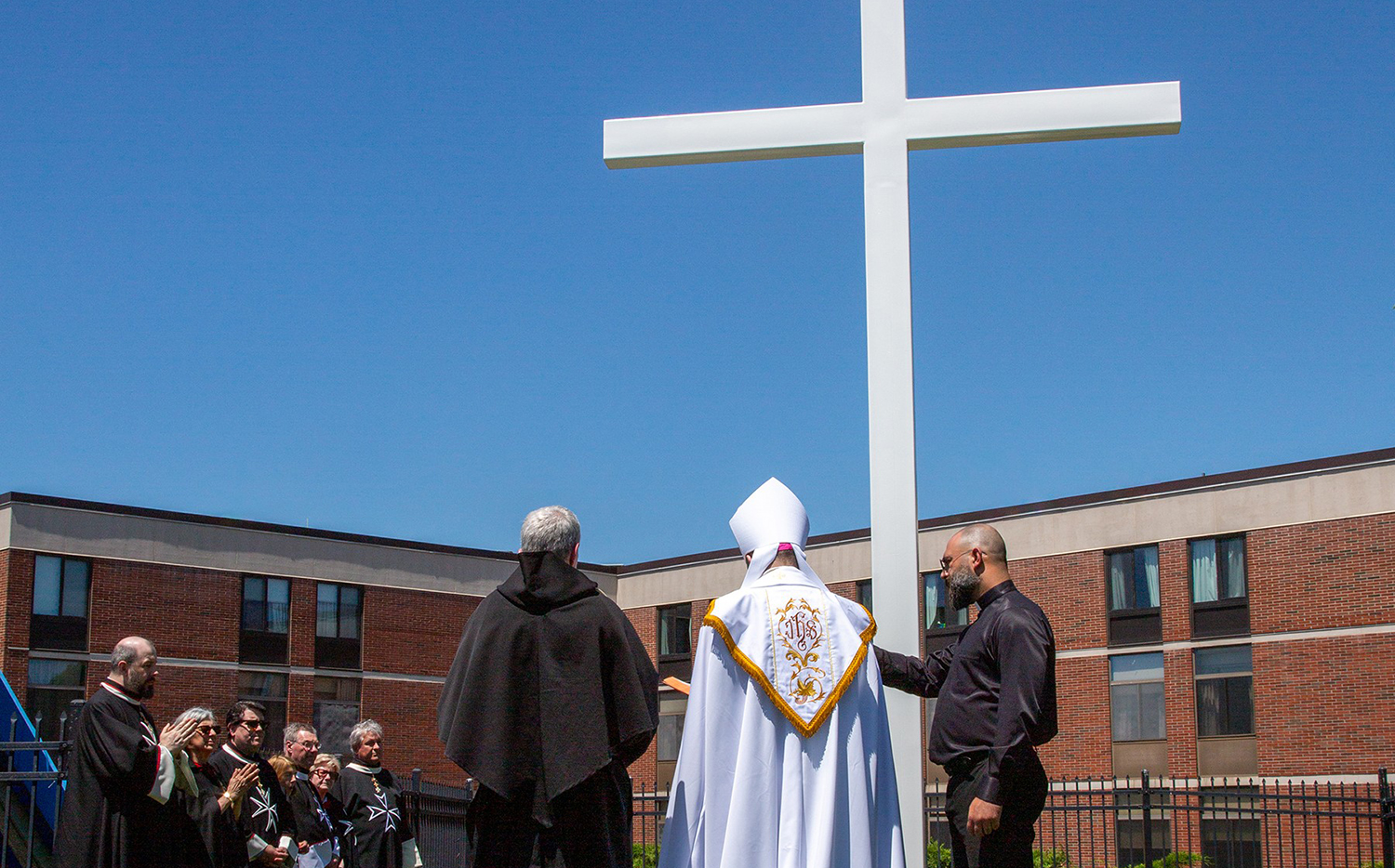 Vicar General and Regional Bishop Robert F. Hennessey of the Merrimack Region of the Archdiocese of Boston joined others for a blessing of the relocated cross at Mary Immaculate Health/Care Services in Lawrence, Massachusetts.