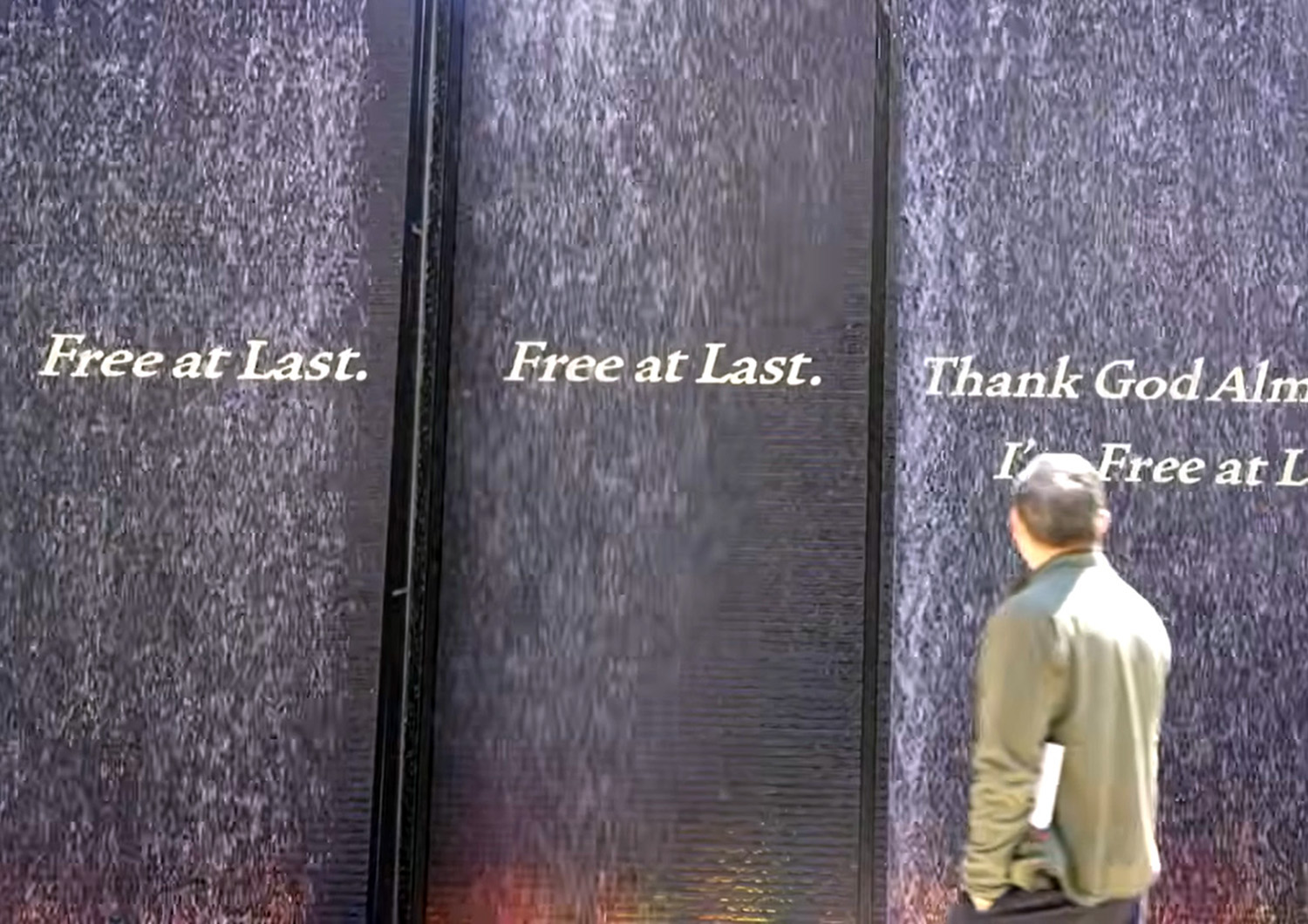 Auxiliary Bishop Felipe Pulido of the Diocese of San Diego takes in one of the pieces at Freedom Monument Sculpture Park in Montgomery, Alabama.