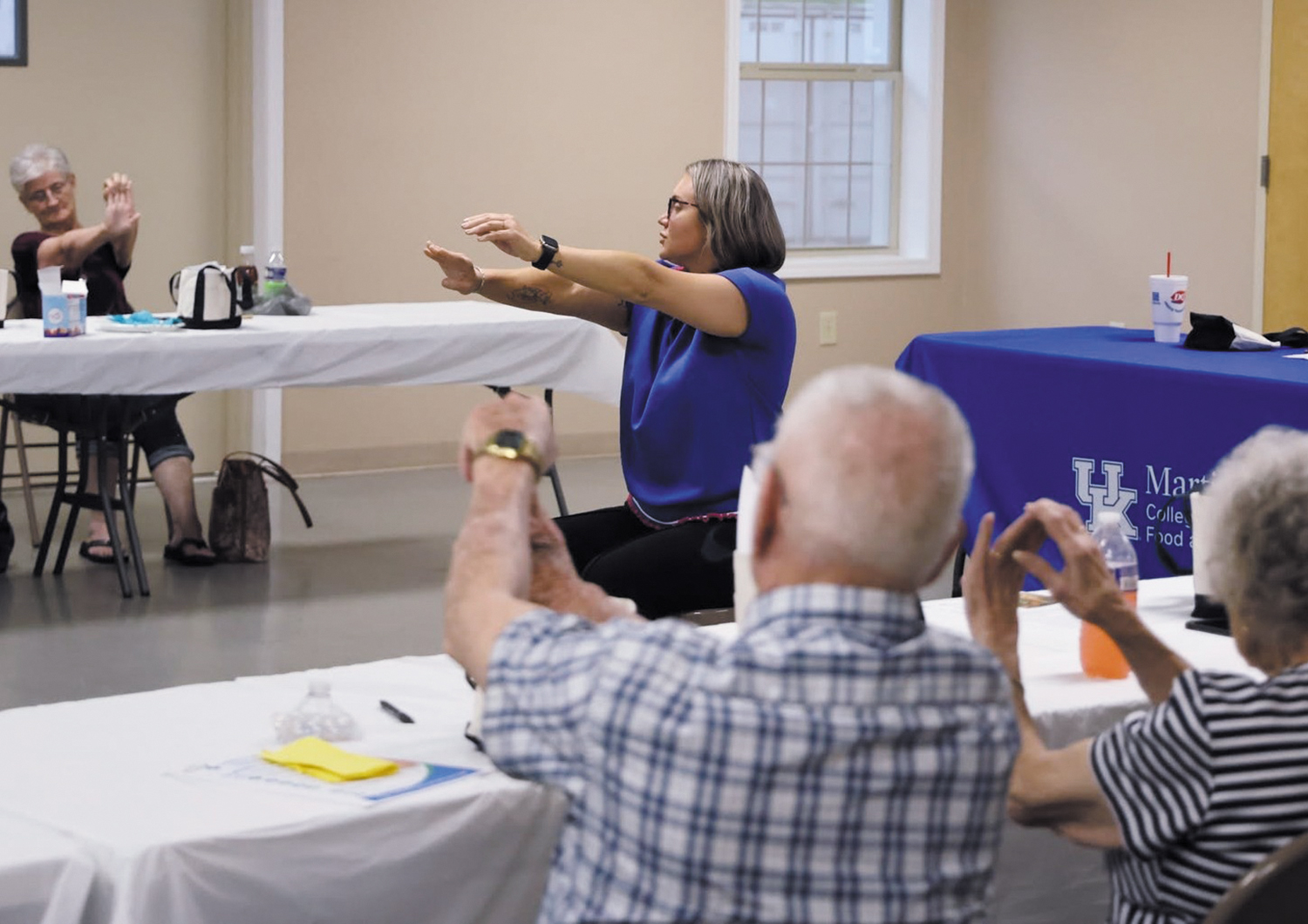 Meghan L. Mills, director of community health at Mercy Health - Marcum and Wallace Hospital in Irvine, Kentucky, leads members of a support group for people dealing with diabetes through some stretching exercises.
