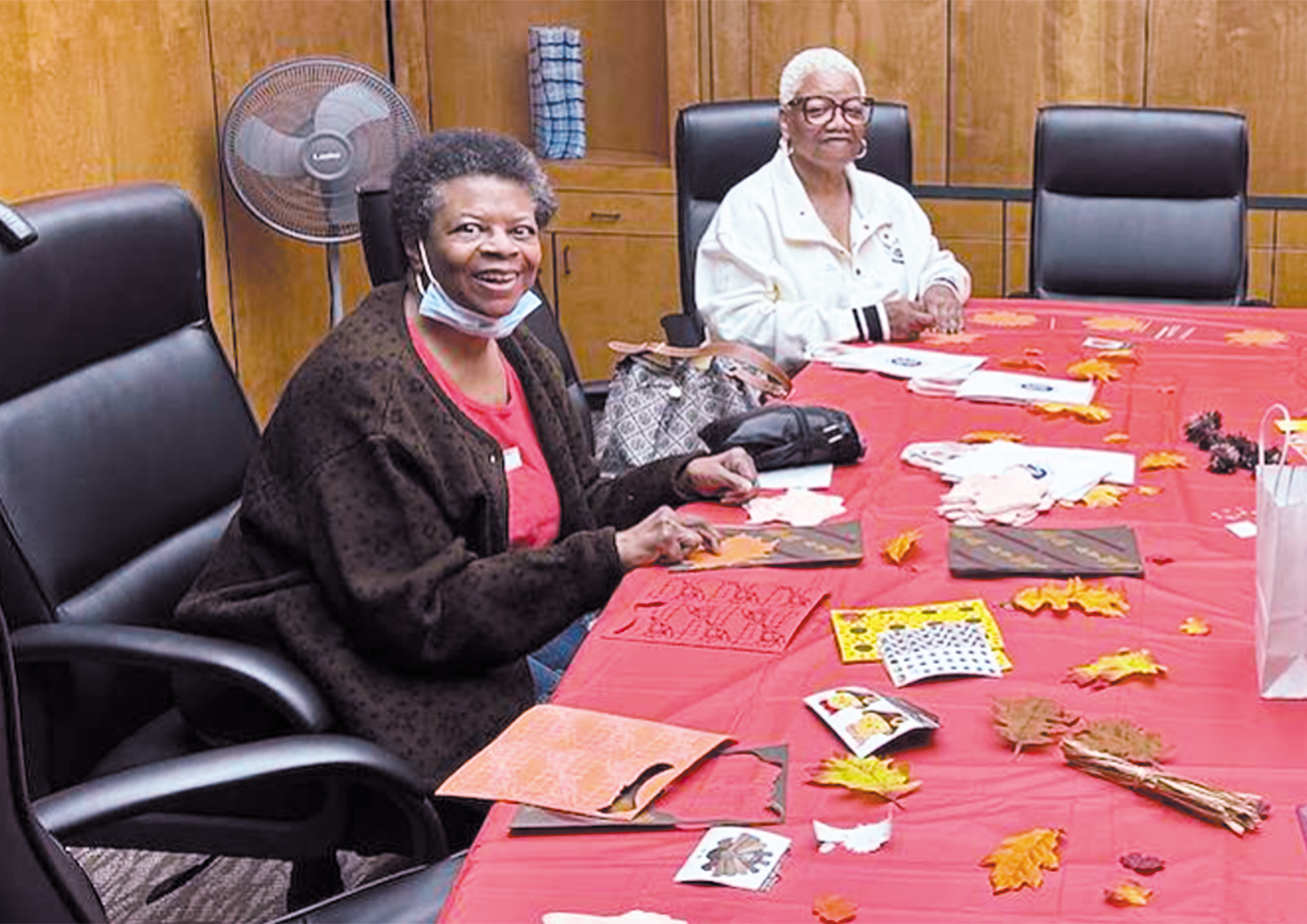 Rosalind French, left, and her buddy, Pamela Bradley, complete a craft together during a gathering of the SSM Health Visit-A-Bit Program based in St. Louis.